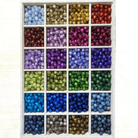 1010 - Glitter prune - Perles Polaris rondes 10mm