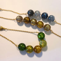 1016 - Glitter émeraude - Perles Polaris rondes 10mm
